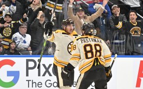 Boston Bruins forward Brad Marchand celebrates with forward David Pastrnak against Toronto Maple Leafs