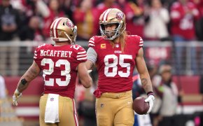 San Francisco 49ers tight end George Kittle (85) celebrates with running back Christian McCaffrey (23)