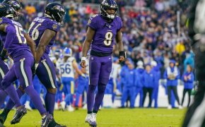 Baltimore Ravens QB Lamar Jackson jumping purple jersey