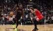 Miami Heat forward Jimmy Butler dribbles against Chicago Bulls guard Coby White