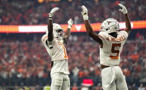 Texas Longhorns wide receivers Adonai Mitchell (5) and Xavier Worthy (1) celebrate a touchdown