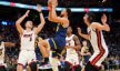 Golden State Warriors guard Stephen Curry shooting a floater against the Miami Heat