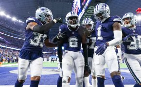 Dallas Cowboys safety Donovan Wilson (6) celebrates with teammates after making an interception