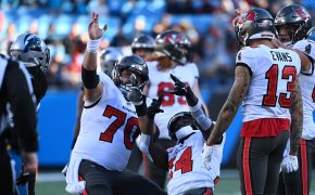 Tampa Bay Buccaneers center Robert Hainsey (70) and wide receiver Chris Godwin (14) signal a first down i