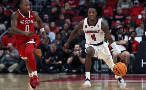 Louisville’s Ty-Laur Johnson dribbles up the court against NC State