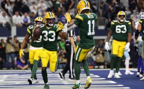 Green Bay Packers running back Aaron Jones (33) reacts after scoring a touchdown against the Dallas Cowboys