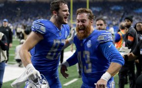 Detroit Lions tight end Sam LaPorta (87) and long snapper Jake McQuaide (43) celebrate after a 2024 NFC wild card game against the Los Angeles Rams