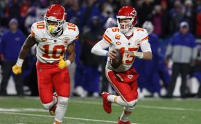 Kansas City Chiefs Isiah Pacheco keeps tries to screen Patrick Mahomes while Mahomes looks for an open receiver.