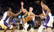 Golden State Warriors guard Stephen Curry drives against three Sacramento Kings defenders