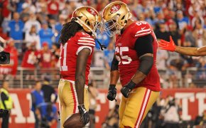 San Francisco 49ers wide receiver Brandon Aiyuk (11) celebrates with guard Aaron Banks (65) after scoring a touchdown