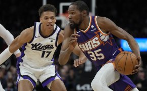 Phoenix Suns forward Kevin Durant drives on Sacramento Kings forward Kessler Edwards