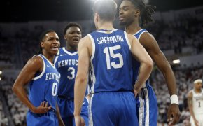 Kentucky Wildcats guard Antonio Reeves reacts with guard Reed Sheppard