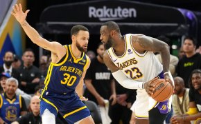 Los Angeles Lakers forward LeBron James handles the ball against Golden State Warriors guard Stephen Curry