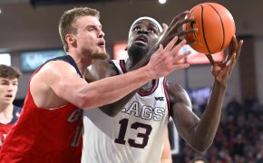 Gonzaga Bulldogs forward Graham Ike is fouled by St. Mary's Gaels center Mitchell Saxen