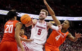 Wisconsin forward Tyler Wahl battles for the ball against Illinois forward Ty Rodgers