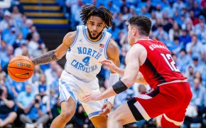 North Carolina Tar Heels guard RJ Davis is guarded by North Carolina State Wolfpack guard Michael O'Connell