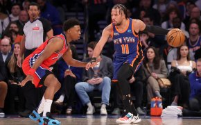 New York Knicks guard Jalen Brunson controls the ball against Philadelphia 76ers guard Kyle Lowry