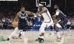 Dallas Mavericks guard Kyrie Irving tries to dribble past Oklahoma City Thunder guard Luguentz Dort