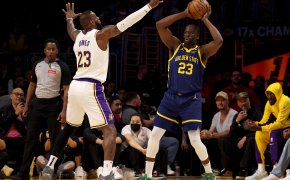 Golden State Warriors forward Draymond Green looks to pass as Los Angeles Lakers forward LeBron James defends