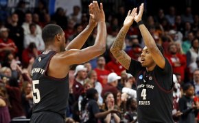 Texas A&M Aggies forward Henry Coleman III and Wade Taylor IV high-fiving