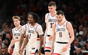 Connecticut Huskies players walking off the court