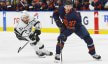 Edmonton Oilers forward Connor McDavid looks to make a pass in front of Los Angeles Kings forward Trevor Lewis