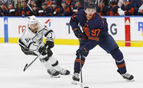 Edmonton Oilers forward Connor McDavid looks to make a pass in front of Los Angeles Kings forward Trevor Lewis