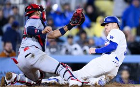 Los Angeles Dodgers first baseman Freddie Freeman slides into home as St. Louis Cardinals catcher Ivan Herrera tries to apply the tag