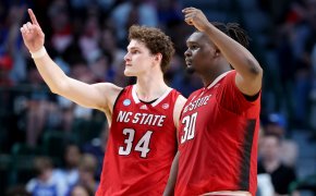 North Carolina State Wolfpack forward Ben Middlebrooks and center DJ Burns Jr gesture to the crowd