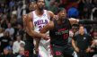 Miami Heat forward Jimmy Butler boxes out Philadelphia 76ers center Joel Embiid