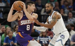 Phoenix Suns guard Grayson Allen holds the ball as Minnesota Timberwolves guard Mike Conley defends
