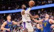 Los Angeles Lakers forward LeBron James goes for a layup against the Denver Nuggets