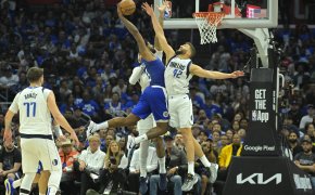 Dallas Mavericks forward Maxi Kleber blocking a dunk attempt by Los Angeles Clippers forward Paul George