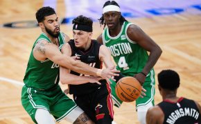 Miami Heat guard Tyler Herro drives the ball against Boston Celtics forward Jayson Tatum in the second half during game two of the first round for the 2024 NBA playoffs