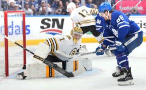 Toronto Maple Leafs right wing William Nylander battles for the puck in front of Boston Bruins goaltender Jeremy Swayman