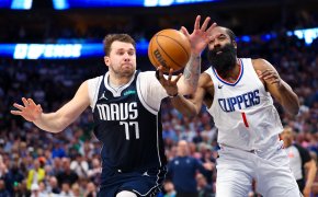 Dallas Mavericks guard Luka Doncic and LA Clippers guard James Harden going after a loose ball
