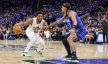 Cleveland Cavaliers guard Donovan Mitchell dribbles while Orlando Magic forward Paolo Banchero defends