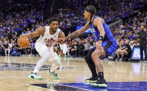 Cleveland Cavaliers guard Donovan Mitchell dribbles while Orlando Magic forward Paolo Banchero defends
