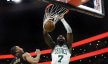 Boston Celtics guard Jaylen Brown dunking against the Cleveland Cavaliers