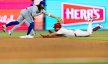 Philadelphia Phillies designated hitter Kyle Schwarber slides into second base as Toronto Blue Jays shortstop Bo Bichette tries to tag him out
