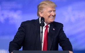 Donald Trump smiling at podium