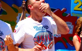 Joey Chestnut downing hot dogs