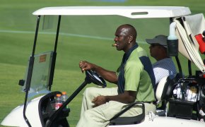 MJ rides golf cart