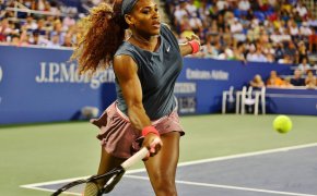 Serena Williams about to hit tennis ball