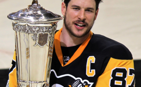 Sidney Crosby holding the Prince of Wales Trophy