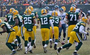 Aaron Rodgers exiting the huddle.