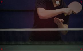 person playing table tennis