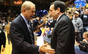 Duke coach Mike Krzyzewski shaking hands with Michigan coach Jon Beilein.