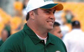 Mike McCarthy smiling on the sidelines