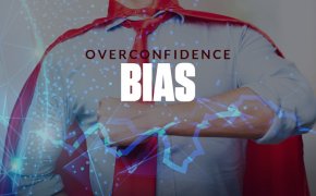 overconfidence bias text overlay as man dressed as superman